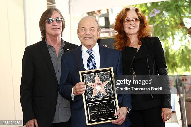 Singer Jackson Browne, music executive Joe Smith and singer Bonnie Raitt attend a ceremony honoring music executive Joe Smith wtih a star on The...