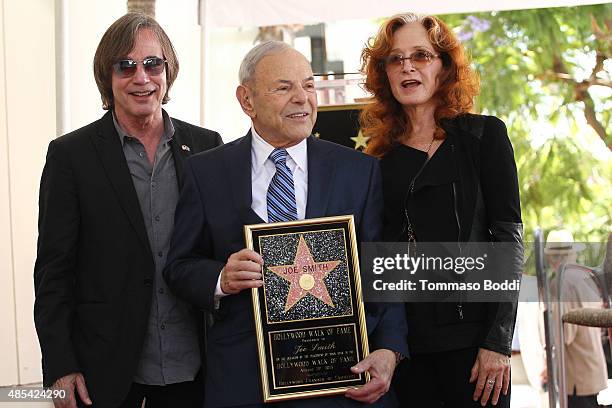 Singer Jackson Browne, music executive Joe Smith and singer Bonnie Raitt attend a ceremony honoring music executive Joe Smith wtih a star on The...