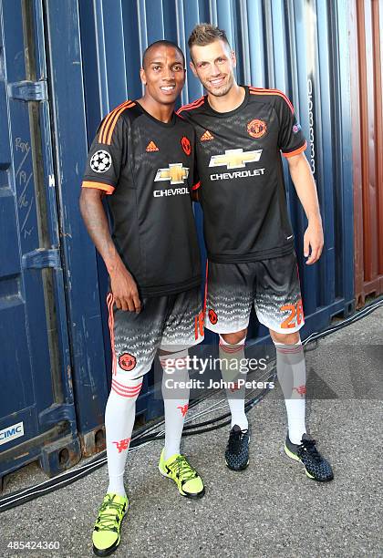 Ashley Young and Morgan Schneiderlin of Manchester United pose at the official launch of the Manchester United third kit in Marseille, on August 27,...