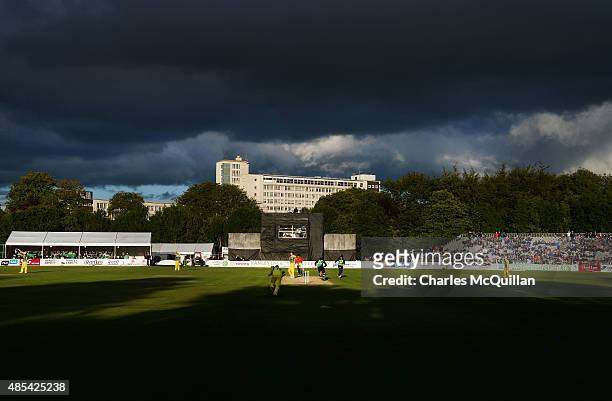 General view of play as heavy rain clouds gather overhead during the ODI cricket game between Ireland and Australia at Stormont cricket ground on...
