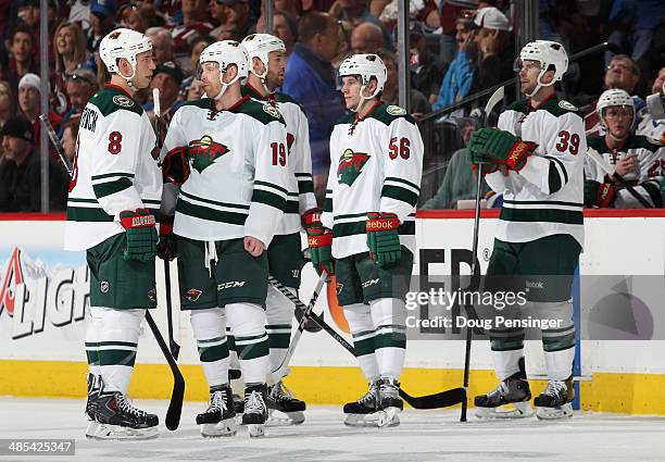 Cody McCormick, Stephane Veilleux, Clayton Stoner, Erik Haula and Nate Prosser of the Minnesota Wild await action against the Colorado Avalanche in...