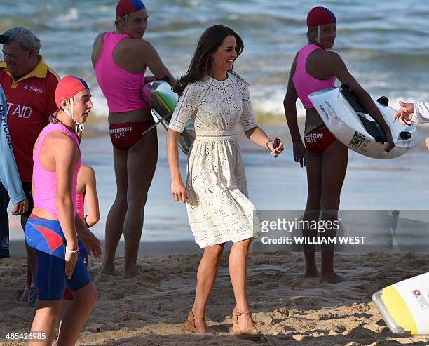 Catherine, the Duchess of Cambridge, runs along the beach at Manly, on Sydney's north shore on April 18, 2014. Britain's Prince William, his wife...