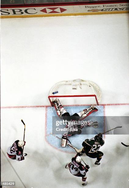 Goalie Dominik Hasek of the Buffalo Sabres misses the final puck which was shot by Brett Hull of the Dallas Stars during the Stanley Cup Finals game...