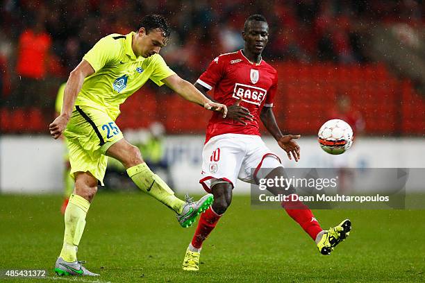 Vegard Forren of Molde FK clears the ball away from Mohamed Yattara of Standard Liege during the UEFA Europa League play off round second leg match...