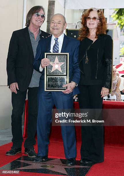 Music executive Joe Smith is honored with a Star on the Hollywood Walk of Fame, and poses with Jackson Browne and Bonnie Raitt during the...