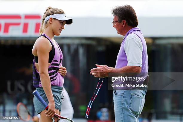 Eugenie Bouchard of Canada and her coach Jimmy Connors talk on the practice court prior to the 2015 U.S. Open at USTA Billie Jean King National...