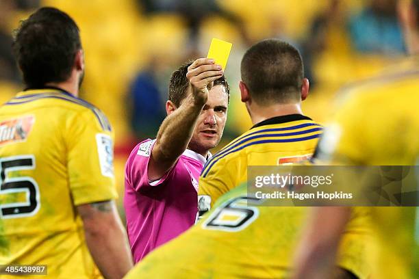 Referee Nick Briant shows Dane Coles of the Hurricanes a yellow card during the round ten Super Rugby match between the Hurricanes and the Blues at...