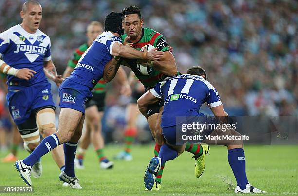 John Sutton of the Rabbitohs is tackled during the round seven NRL match between the South Sydney Rabbitohs and the Canterbury-Bankstown Bulldogs at...