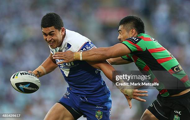 Tim Lafai of the Bulldogs is tackled by kirisome Auva'a of the Rabbitohs during the round seven NRL match between the South Sydney Rabbitohs and the...