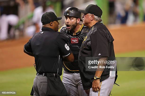 Francisco Cervelli of the Pittsburgh Pirates argues after being thrown out by umpire Alan Porter during the third inning of the game against the...