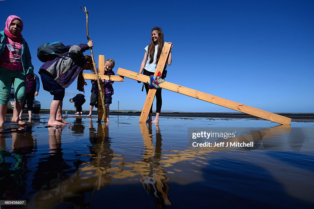 Pilgrims From Across The UK Carry Crosses To Holy Island