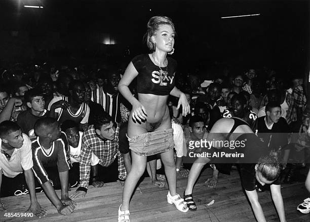 Fans of the rap group "2 Live Crew" watch as their dancers perform at Zippers in circa 1988 Miami.
