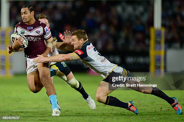 Steve Matai of the Sea Eagles beats the Cowboys defence during the round seven NRL match between the Manly-Warringah Sea Eagles and the North...