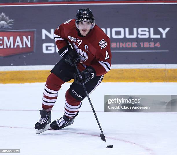 Matt Finn of the Guelph Storm skates with the puck against the Erie Otters in Game One of the OHL Western Conference Final at the Sleeman Centre on...