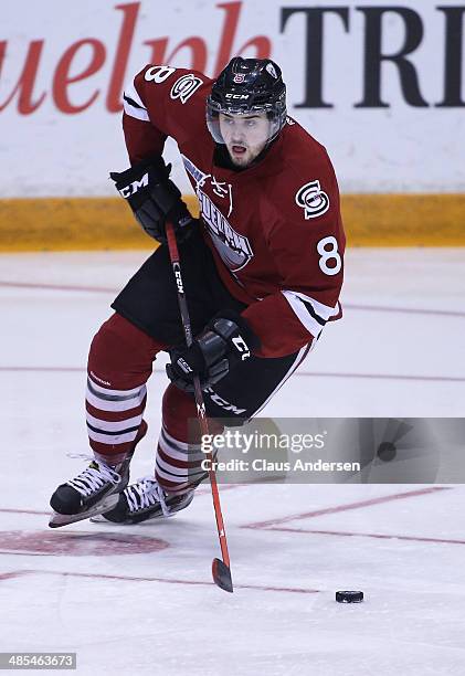 Zac Leslie of the Guelph Storm skates with the puck against the Erie Otters in Game One of the OHL Western Conference Final at the Sleeman Centre on...