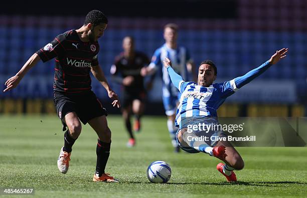 James Perch of Wigan Athletic attempts to tackle Jobi McAnuff of Reading during the Sky Bet Championship match between Wigan Athletic and Reading at...