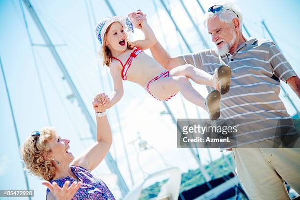 enjoying on vacations with her grandparents - grandparents raising grandchildren stock pictures, royalty-free photos & images