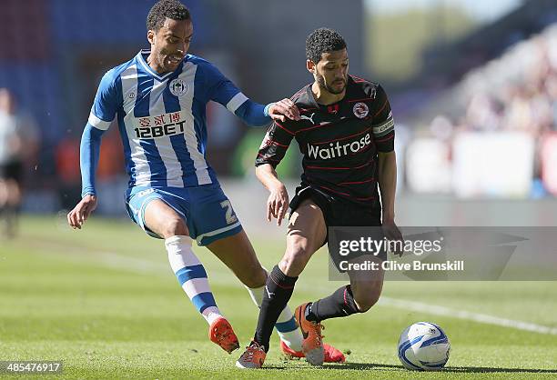 James Perch of Wigan Athletic in action with Jobi McAnuff of Reading during the Sky Bet Championship match between Wigan Athletic and Reading at DW...