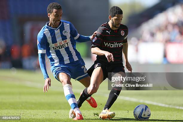 James Perch of Wigan Athletic in action with Jobi McAnuff of Reading during the Sky Bet Championship match between Wigan Athletic and Reading at DW...