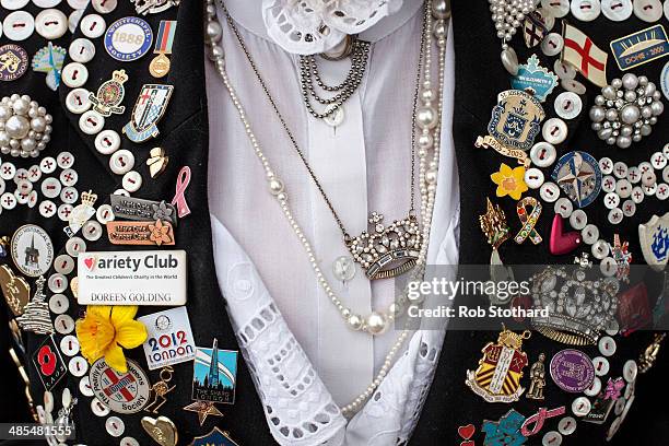 Pearly Queen Doreen Golding shows her outfit outside the Widow's Son pub in Bromley-by-Bow on April 18, 2014 in London, England. The Widow's Son was...