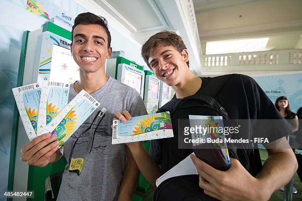 Football fans purchase tickets during a FIFA venue ticketing centre opening for the 2014 FIFA World Cup at Casarao General Severiano on April 18,...