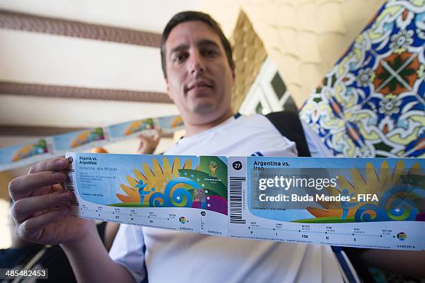 Football fan Roman Devit purchases tickets during a FIFA venue ticketing centre opening for the 2014 FIFA World Cup at Casarao General Severiano on...