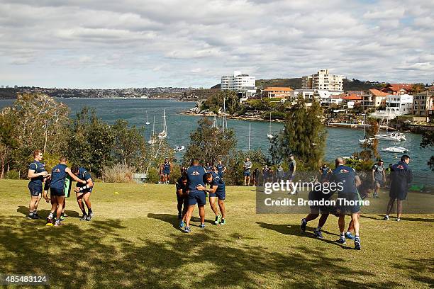 Wallabies players run drills during an Australian Wallabies training session at Little Manly Beach on August 28, 2015 in Sydney, Australia.