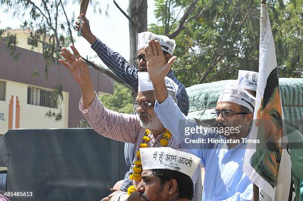 Leader Prashant Bhushan takes part in a road show to solicit votes for party candidate from Indore Lok Sabha seat Anil Trivedi on April 18, 2014 in...