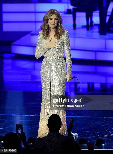 Singer Celine Dion reacts to a standing ovation from the audience as she performs at The Colosseum at Caesars Palace as she resumes her residency on...