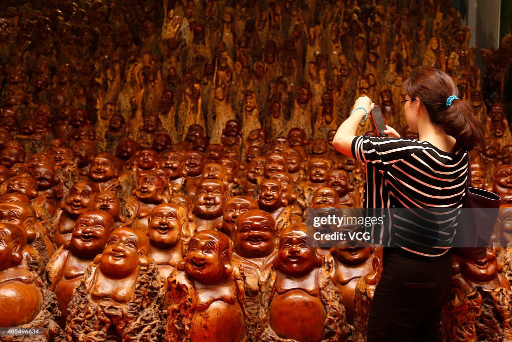 Over 9,900 Buddha Wood Carvings Exhibited In Zhengzhou