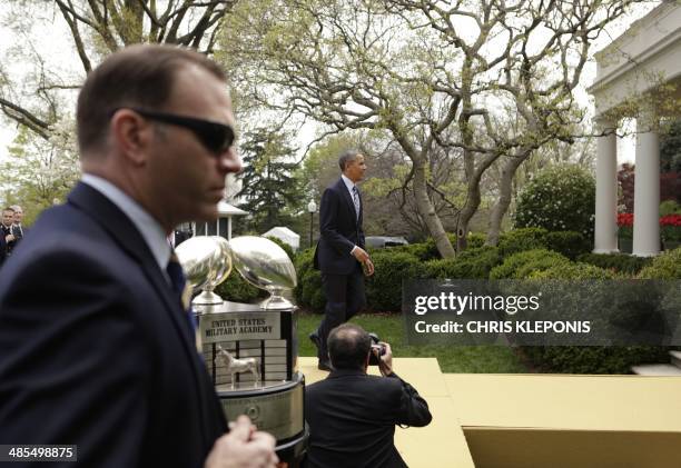 President Barack Obama departs after the presentation of the Commander-in-Chief Trophy to the US Naval Academy Football Team at the White House in...