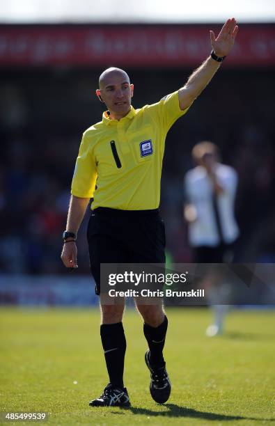 Referee Mark Heywood gestures during the Sky Bet League Two match between Morecambe and Scunthorpe United at Globe Arena on April 18, 2014 in...