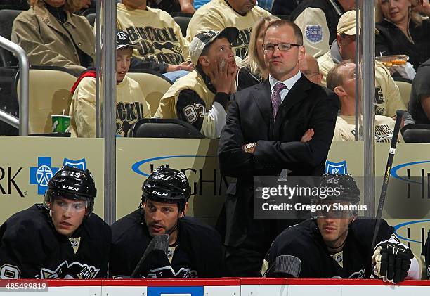 Head Coach Dan Bylsma of the Pittsburgh Penguins looks on against the Columbus Blue Jackets in Game One of the First Round of the 2014 Stanley Cup...