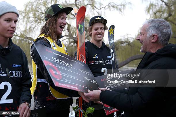 First place James Woods of Great Britain receives his winners cheque from New Zealand Winter Games CEO Arthur Klap during the medal ceremony for the...
