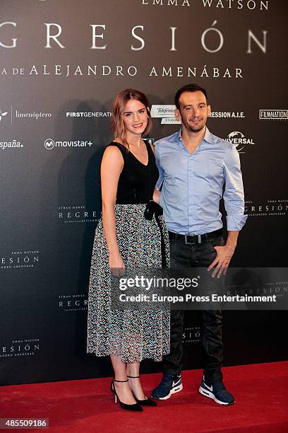 Actress Emma Watson and director Alejandro Amenabar attend 'Regression' photocall at Villamagna hotel on August 27, 2015 in Madrid, Spain.