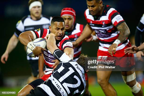 Tony Pulu of Counties is tackled during the round three ITM Cup match between Counties Manukau and Hawkes Bay at ECOLight Stadium on August 28, 2015...