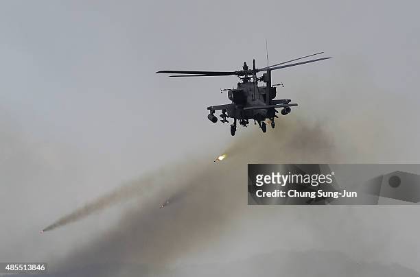 An AH64 Apachi helicopter hovers during the South Korea and U.S. Joint military exercise at the Seungjin firing drill ground on August 28, 2015 in...