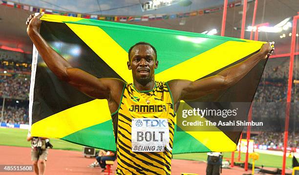 Usain Bolt of Jamaica celebrates winning the gold after the Men's 200m final during day six of the 15th IAAF World Athletics Championships Beijing...