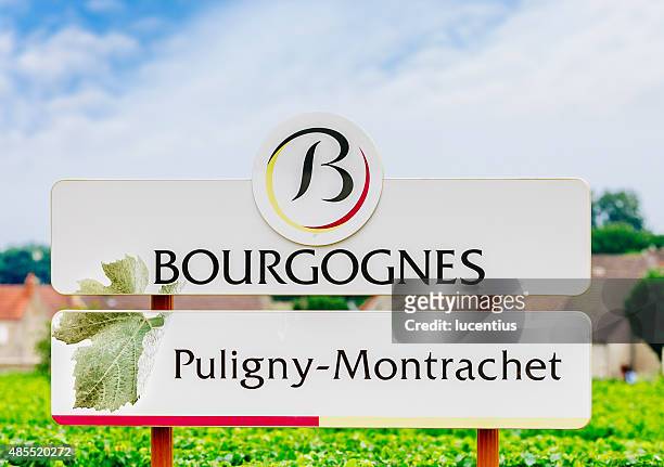 puligny-montrachet straßenschild - montrachet region of burgundy stock-fotos und bilder