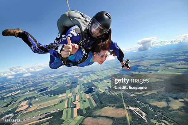 parachute jumping - tandem skydive stock pictures, royalty-free photos & images