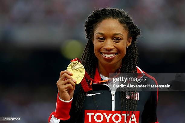 Gold medalist Allyson Felix of the United States poses on the podium during the medal ceremony for the Women's 400 metres final during day seven of...
