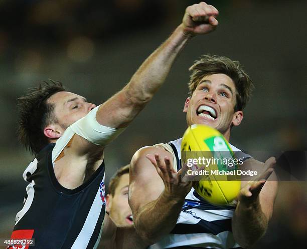 Tom Hawkins of the Cats and Nathan Brown of the Magpies compete for the ball during the round 22 AFL match between the Geelong Cats and the...