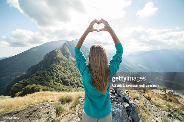 woman giving all her love to the nature - tree hugging stock pictures, royalty-free photos & images