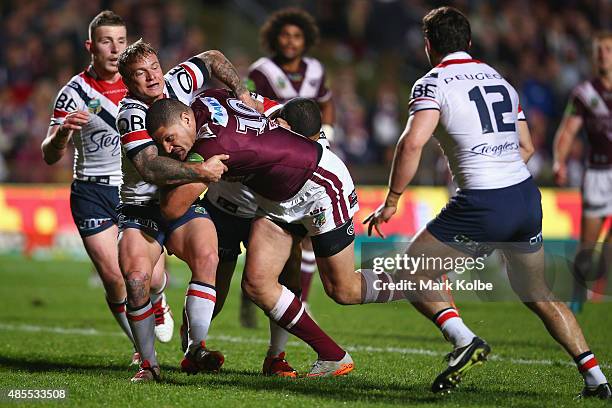 Willie Mason of the Eagles is tackled during the round 25 NRL match between the Manly Warringah Sea Eagles and the Sydney Roosters at Brookvale Oval...