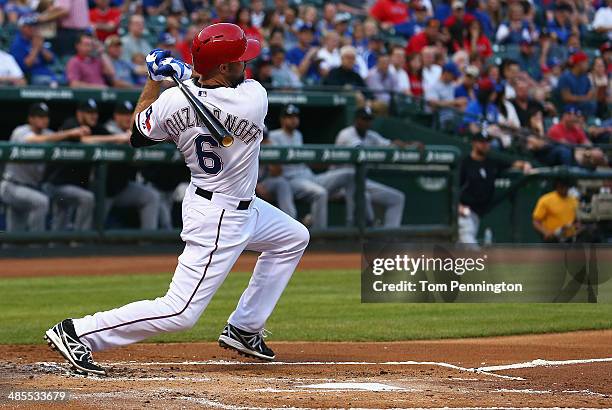 Kevin Kouzmanoff of the Texas Rangers hits an infield single against the Chicago White Sox in the bottom of the first inning at Globe Life Park in...