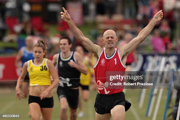 Daniel Veith of Park Orchards celebrates after crossing the line to win Official Supporters Club Stawell Frontmarkers' Handicap during the 2014...