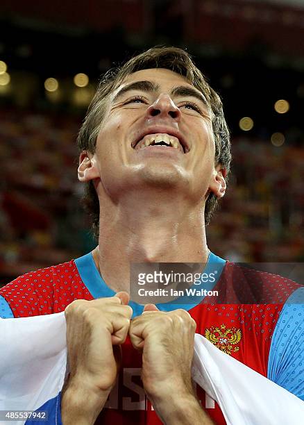Sergey Shubenkov of Russia celebrates after crossing the finish line to win gold in the Men's 110 metres hurdles final during day seven of the 15th...
