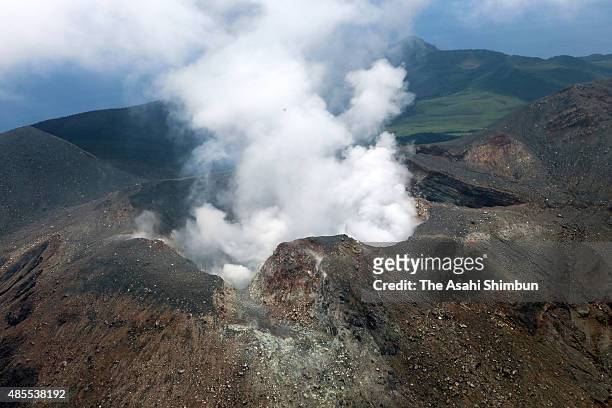 In this aerial image, volcanic smoke rises from Mount Shindake at Kuchinoerabu Island on August 28, 2015 in Yakushima, Kagoshima, Japan. It has been...