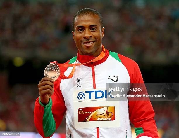 Bronze medalist Nelson Evora of Portugal poses on the podium during the medal ceremony for the Men's Triple Jump final during day seven of the 15th...
