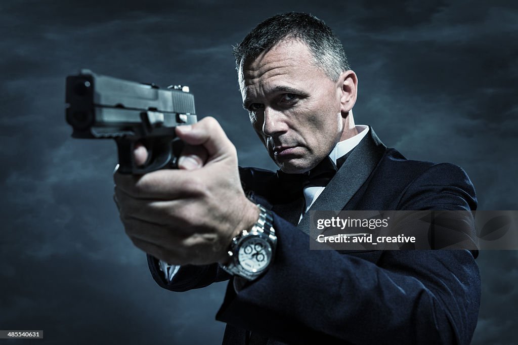 Spy in Tuxedo Aiming Gun